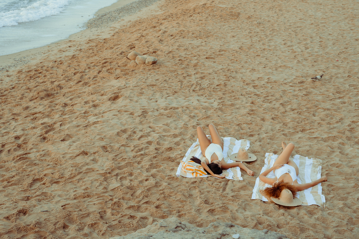 Beach Expedition Women Laying at the Beach